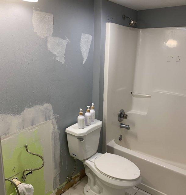 bathroom wall repair in a vacation rental