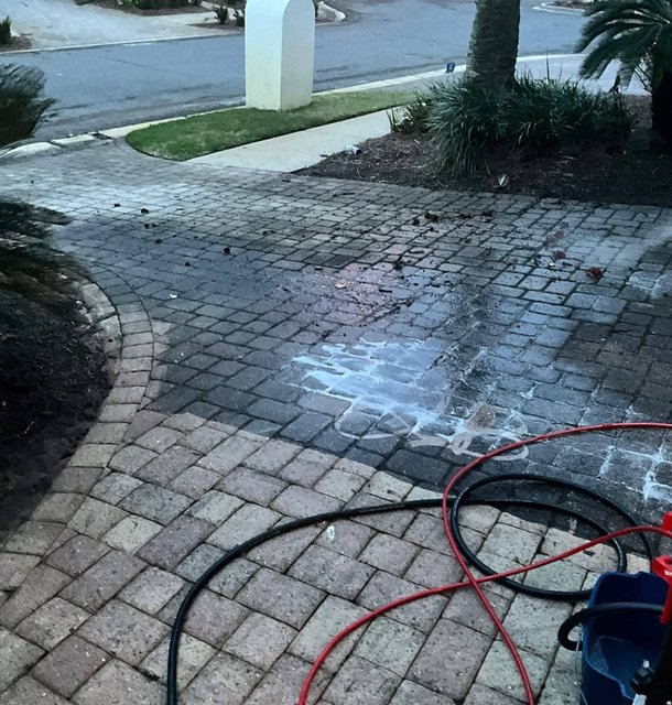 pressure washing a paver driveway